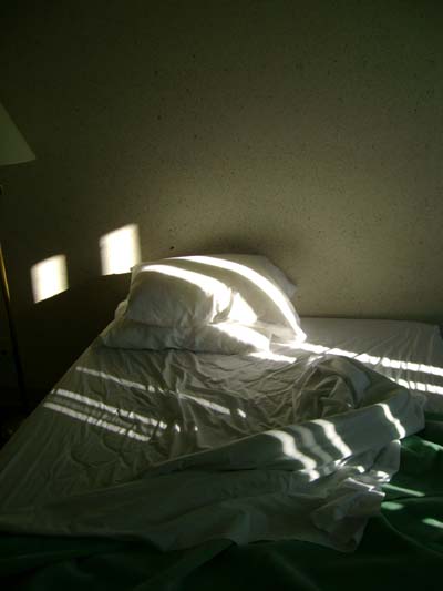The rising sun came right through the missing panels in the blinds and shone right on my face
