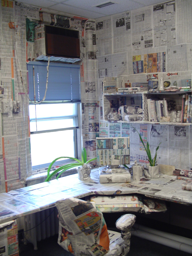 An amazing prank covering her desk with newspaper