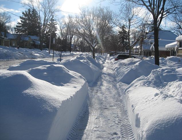 The paths carved through the snow in London. Note that this was taken a few days ago, and we've had over two more feet of snow since, but the banks aren't much higher due to meltage and compression.