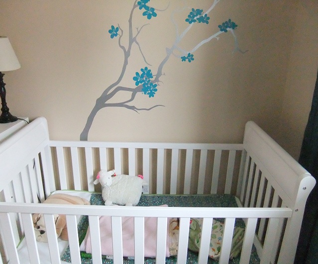 The crib is assembled and the wall decals up.