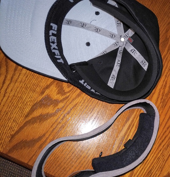 A Goldline headband and Ice Halo Pro-Hat side-by-side on a table.